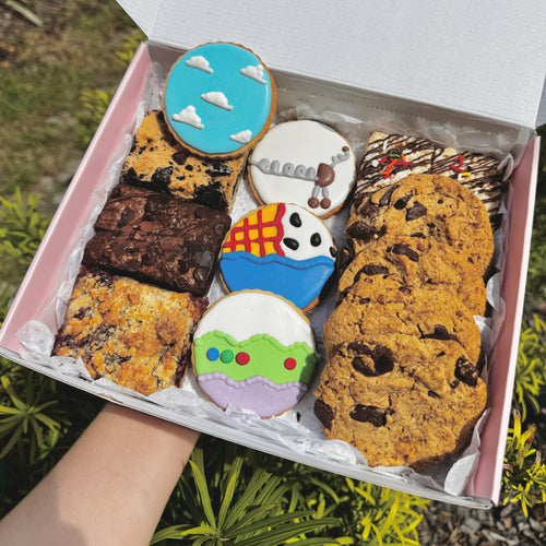 PlayTime treat box with colorful decorated cookies and brownies for kids' parties by Imadia in Orlando